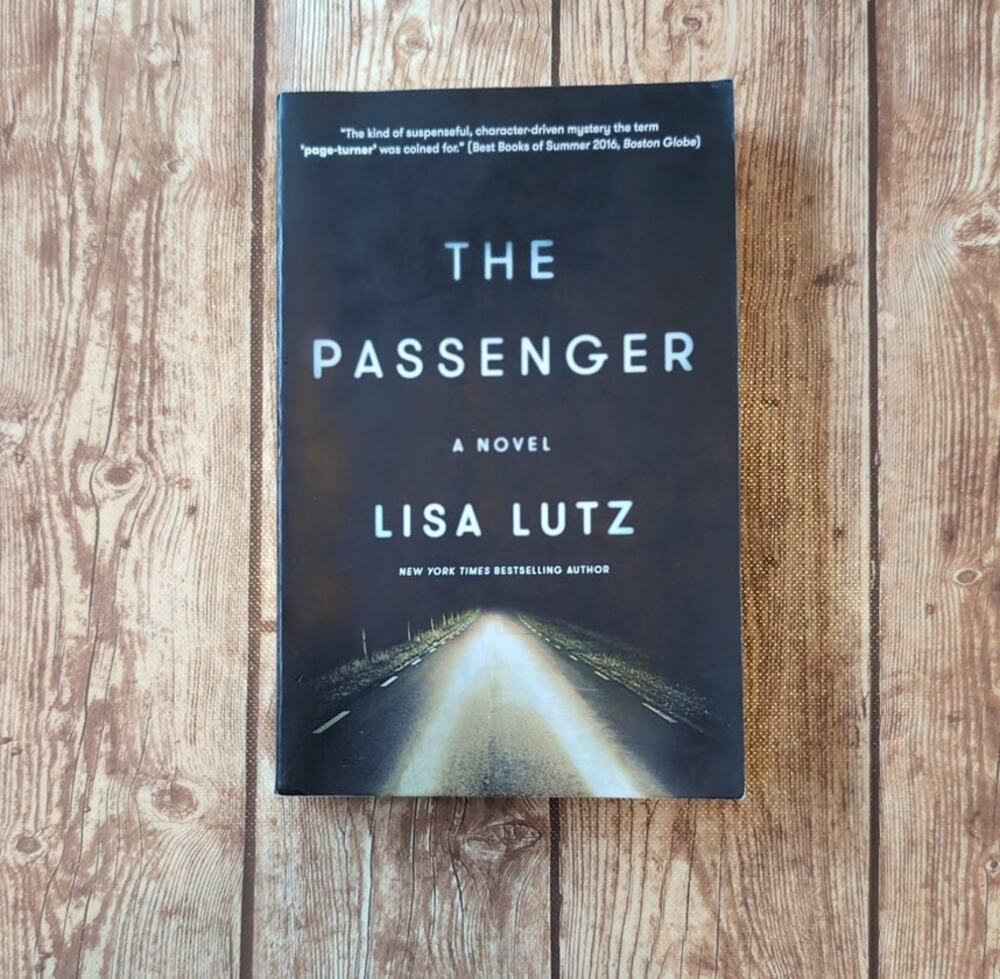 The Passenger A Novel by Lisa Lutz - Paperback Book